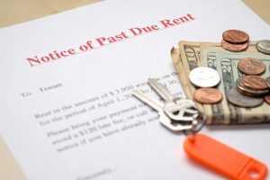 notice of past due rent with keys and money on the table notice of past due rent with keys and money on the table