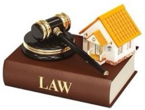 home and judge's gavel on top of a law book home and judge's gavel on top of a law book