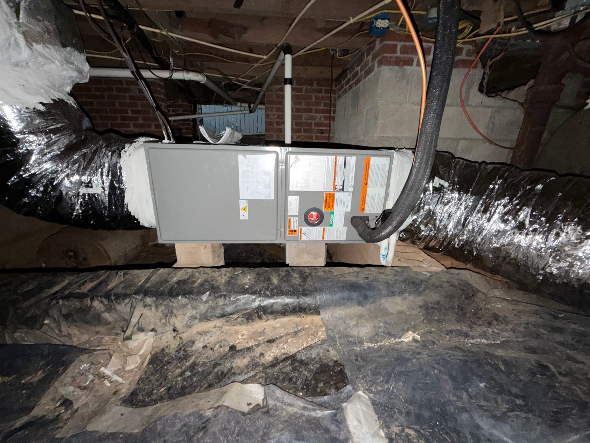 a heat-pump outdoor unit running on a frosty Upstate winter morning