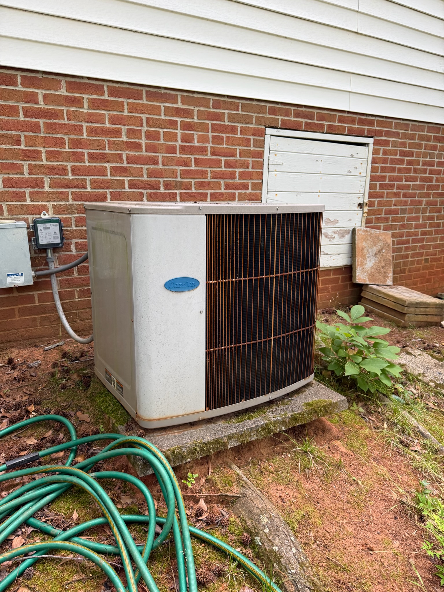 ECS tech diagnosing AC unit
