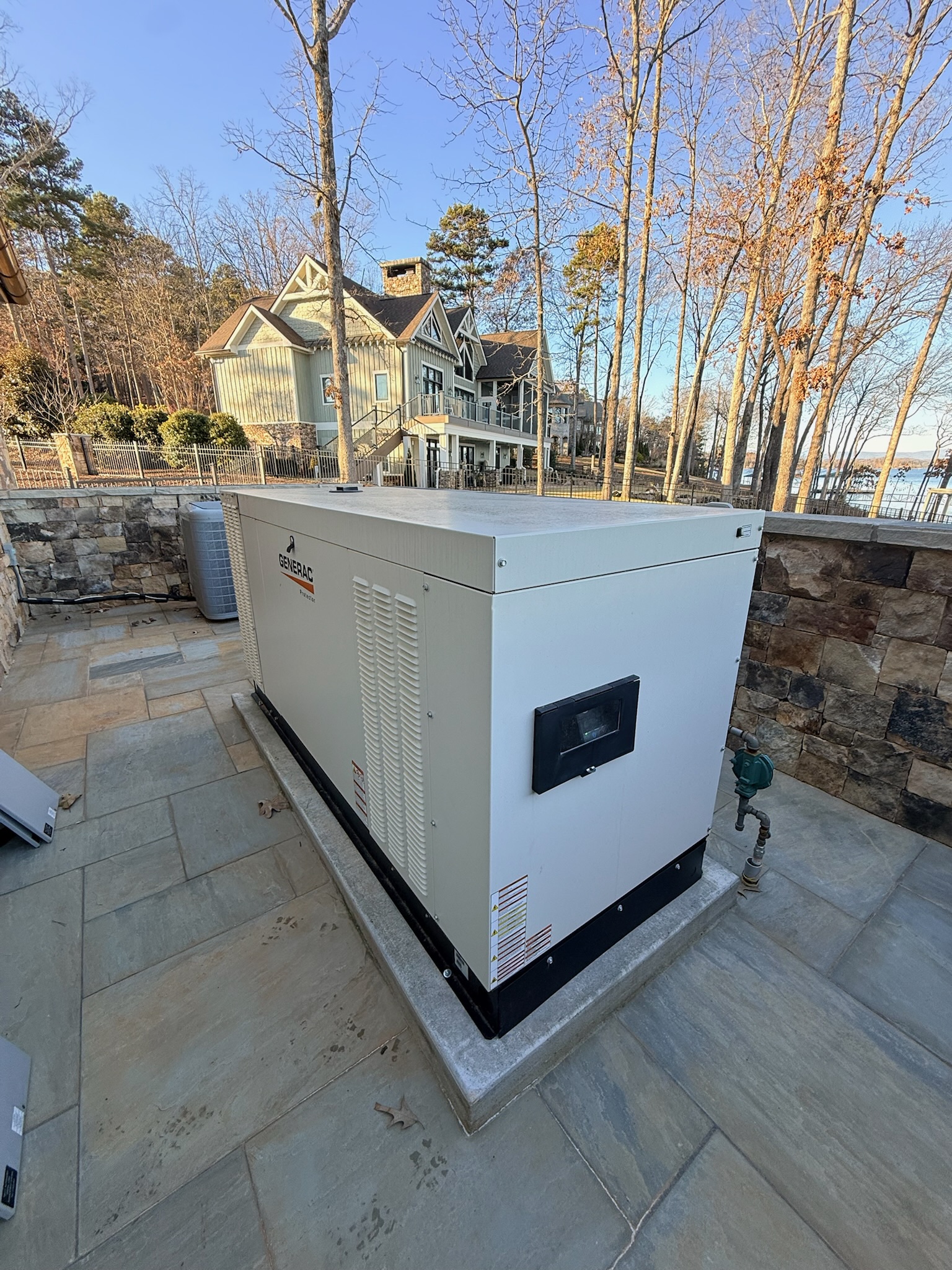 Steven with a homeowner servicing a standby unit