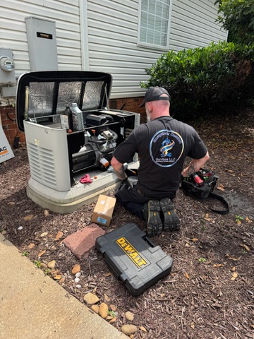 Steven servicing a standby generator beside a home