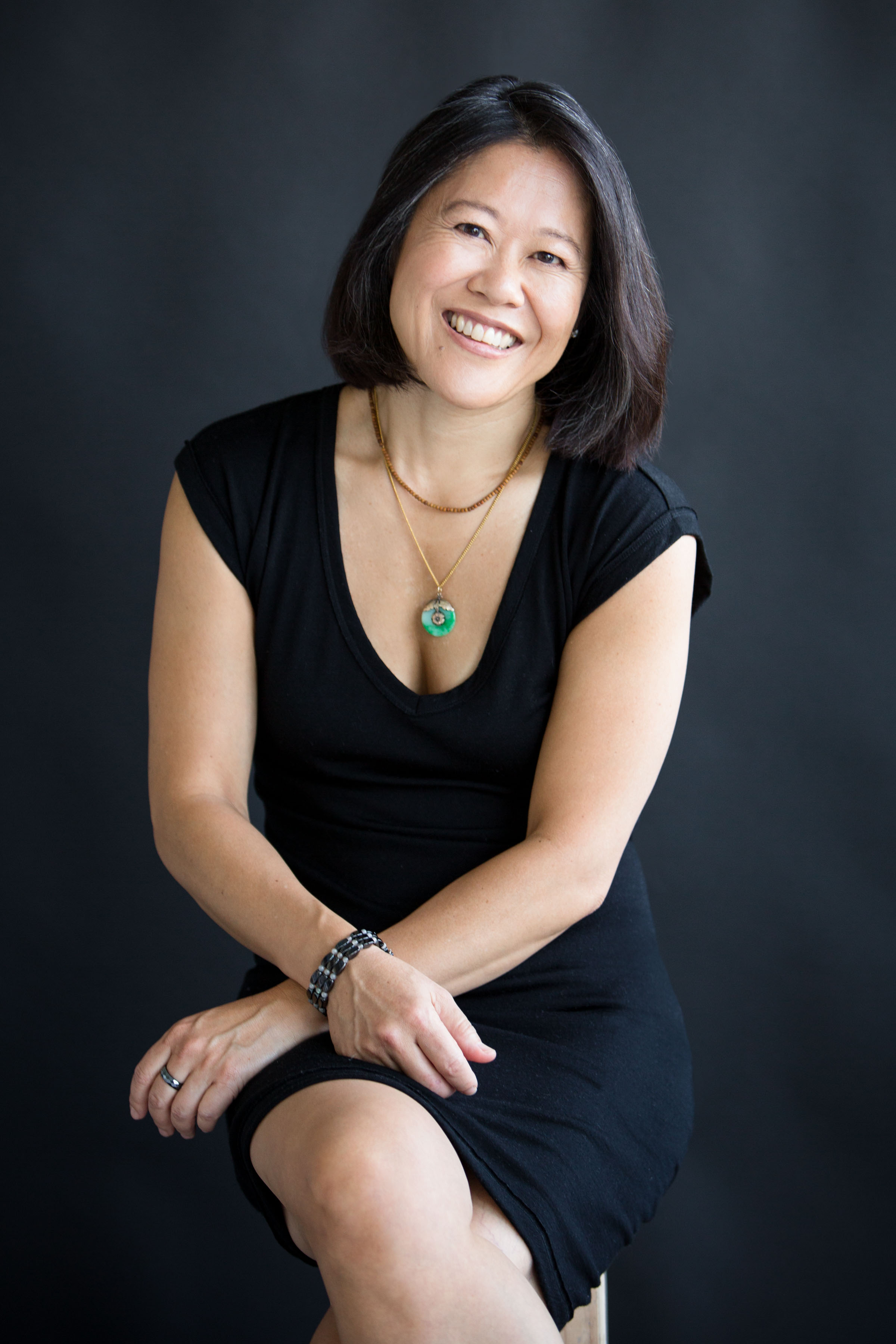 Panda Hershey, founder of Your Full Expression, smiling confidently