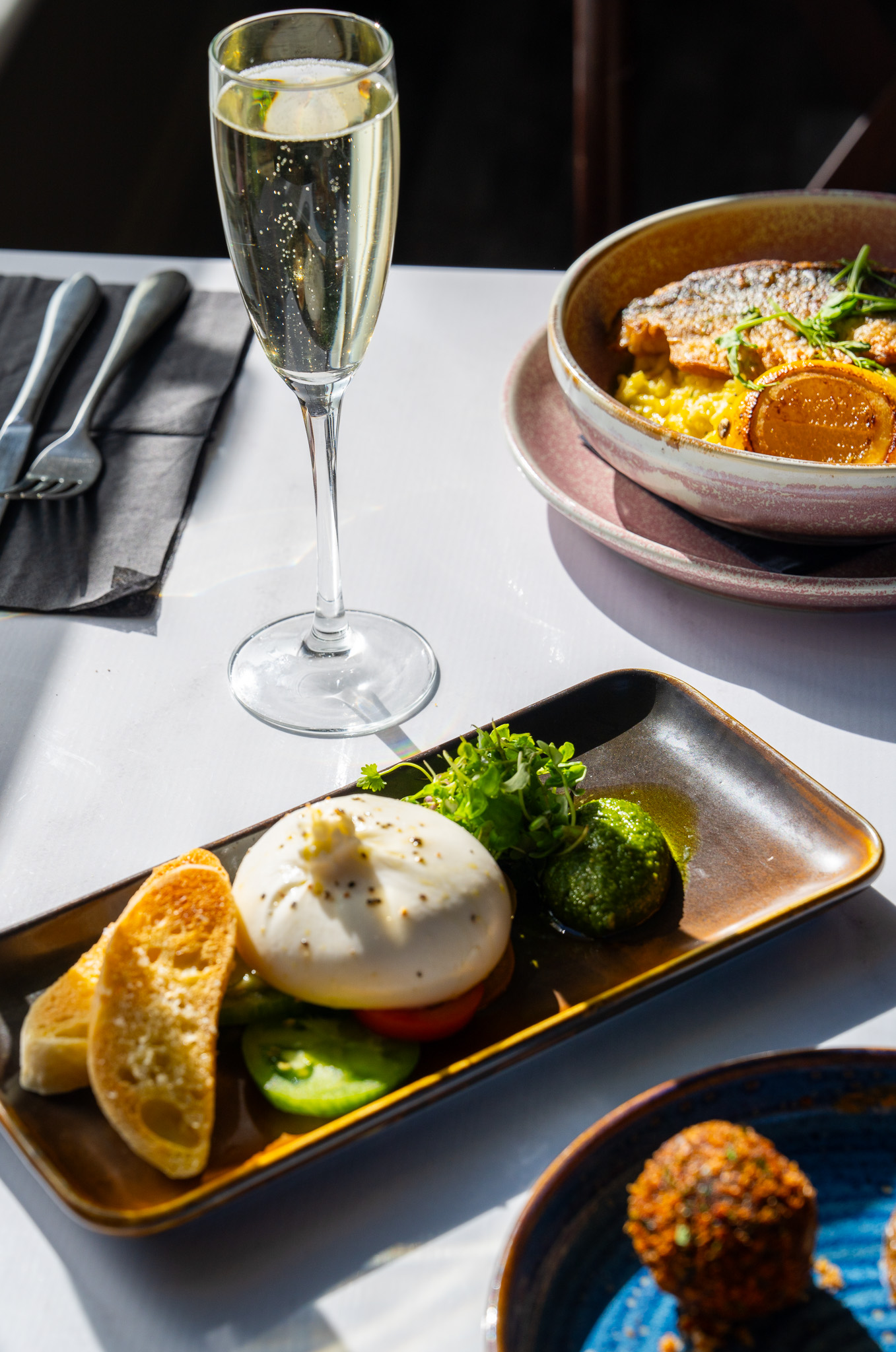 Plated food and prosecco at The Mulberry