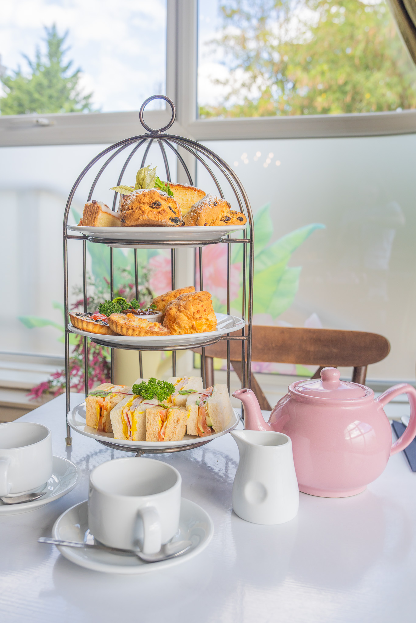 Close detail of afternoon tea cakes and patisserie