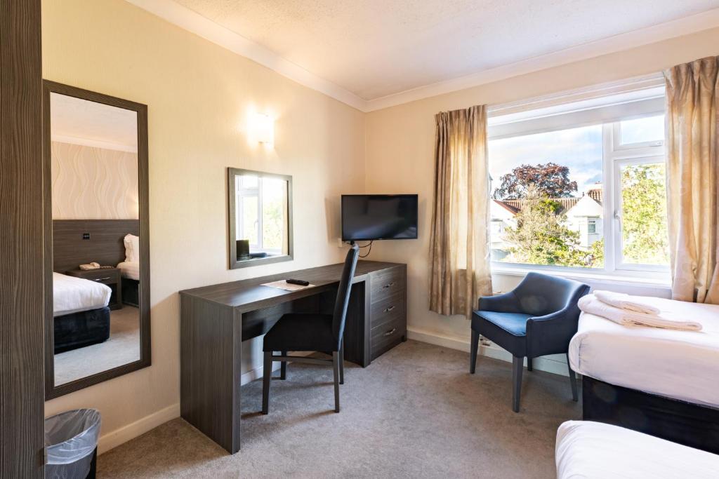 A well-appointed bedroom at Parkmore Hotel