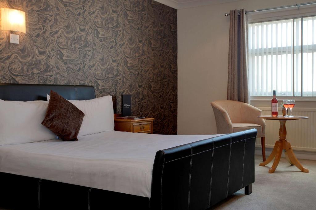 Comfortable bedroom at Parkmore Hotel