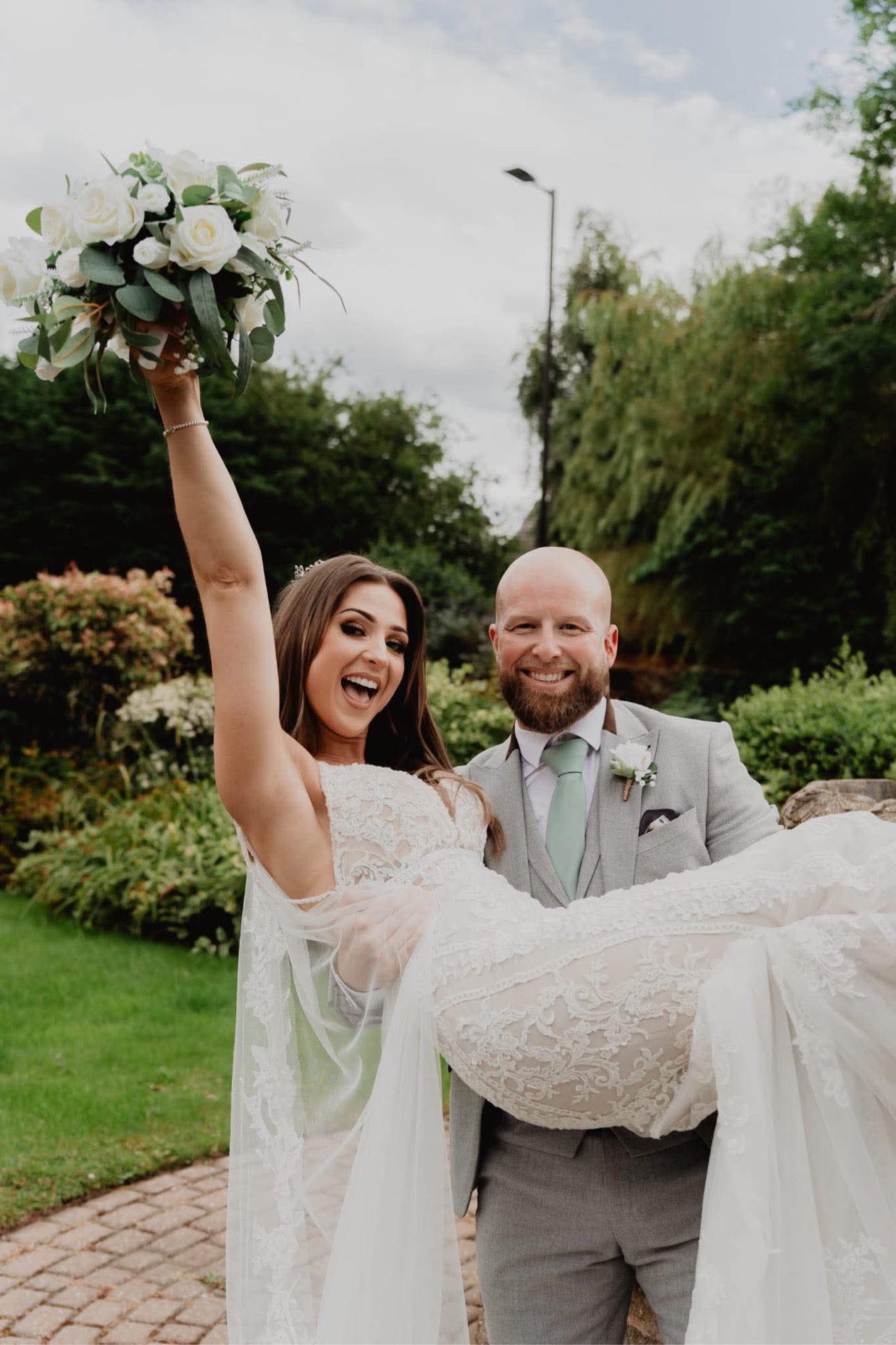 Groom carrying the bride