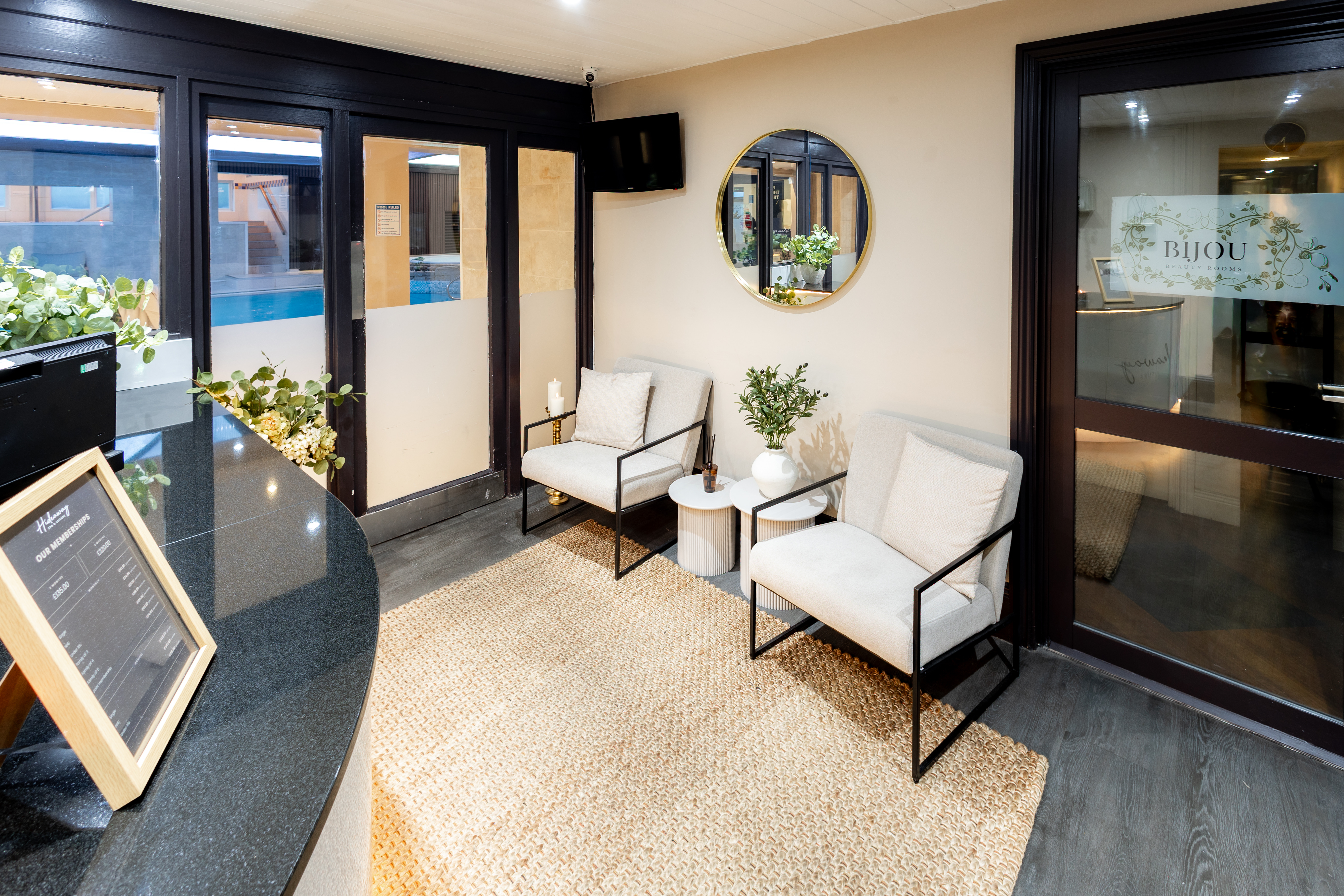 Reception waiting area with seating at The Hideaway Spa
