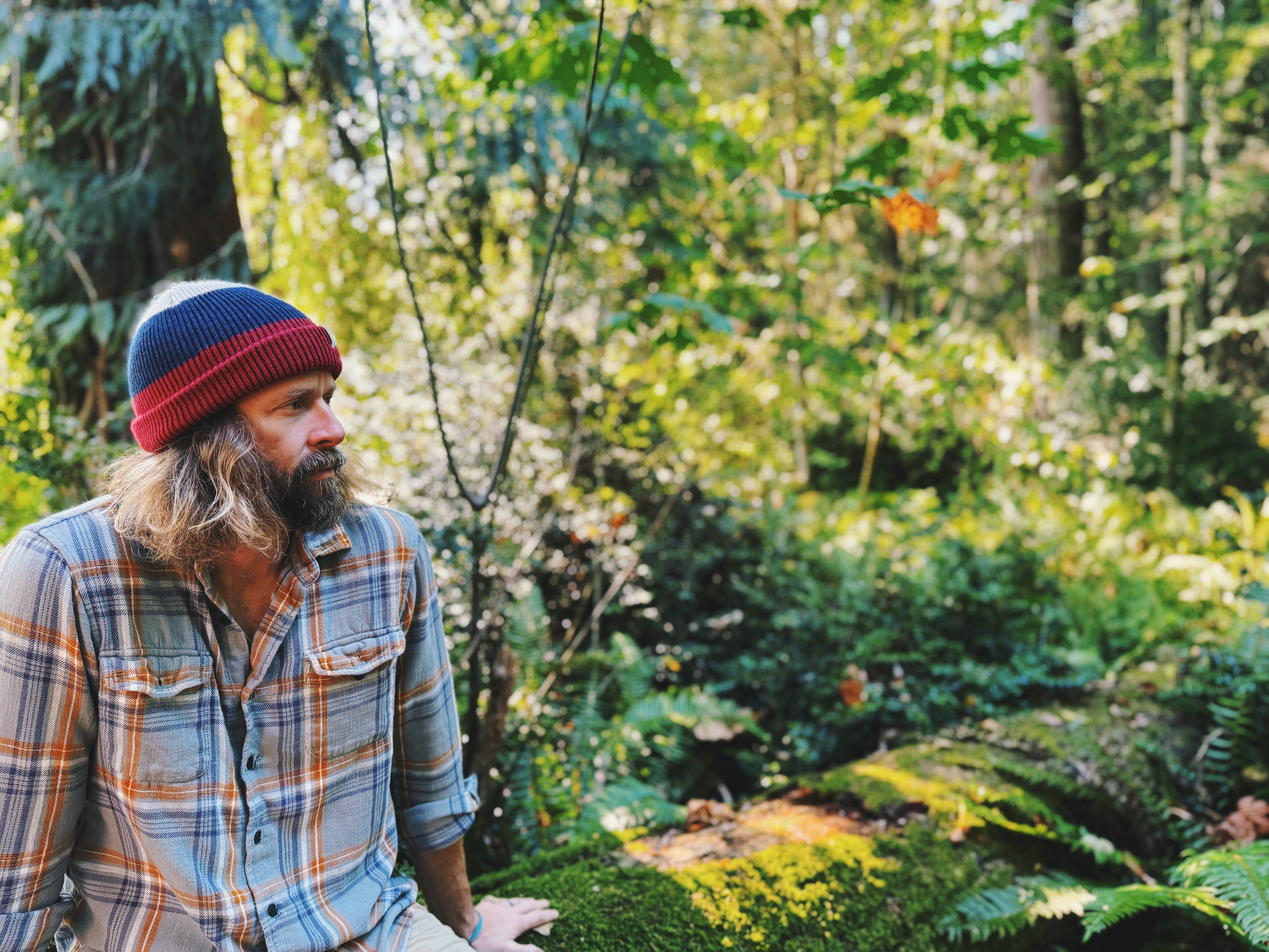 Andy Taylor seated in a Pacific Northwest forest