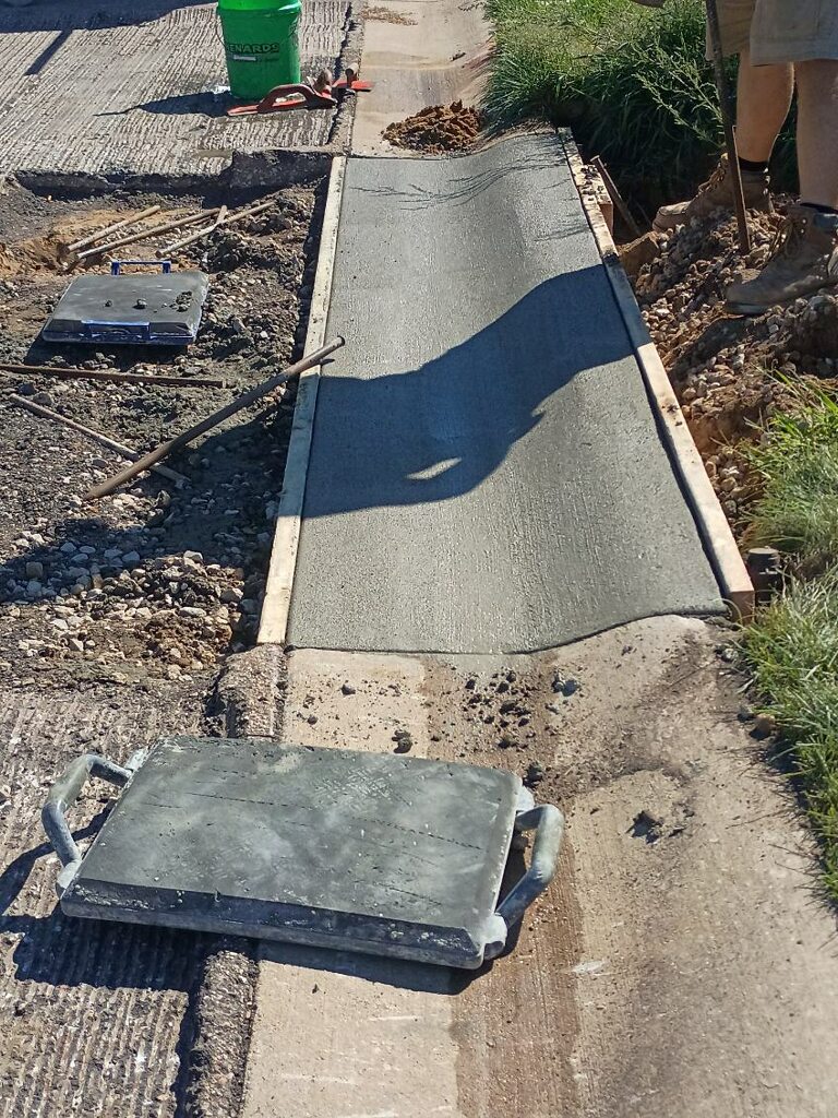 Concrete walkway installed by Kelly's Custom Concrete