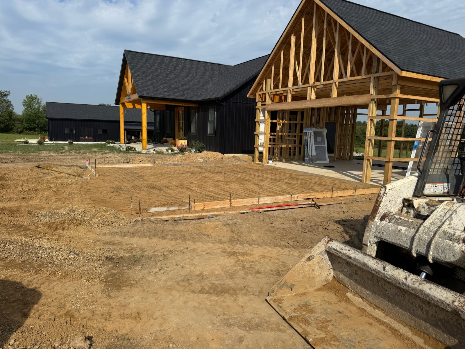Excavated and formed concrete foundation for a new building addition