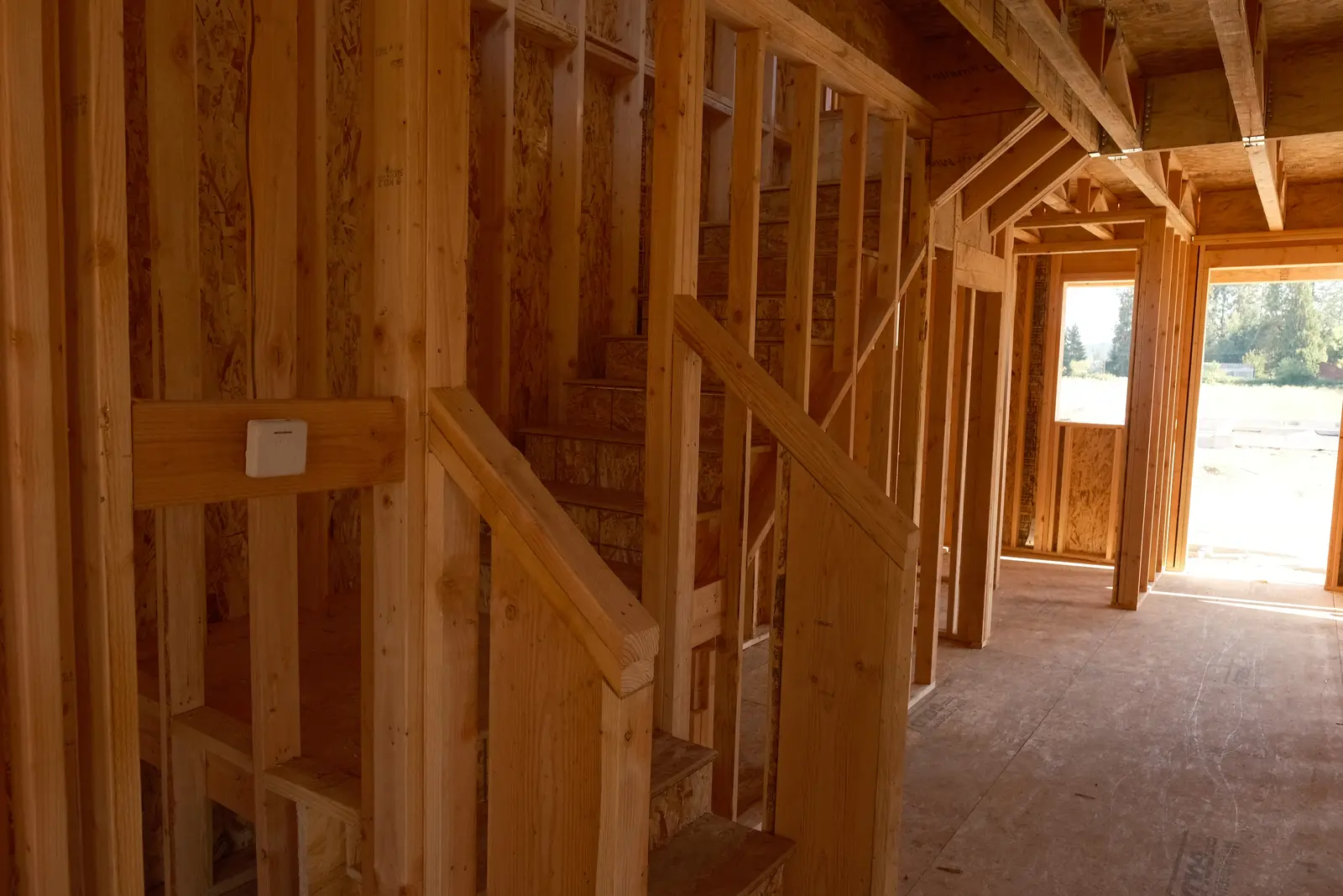 Wood stair and interior wall framing at a Holt Homes project