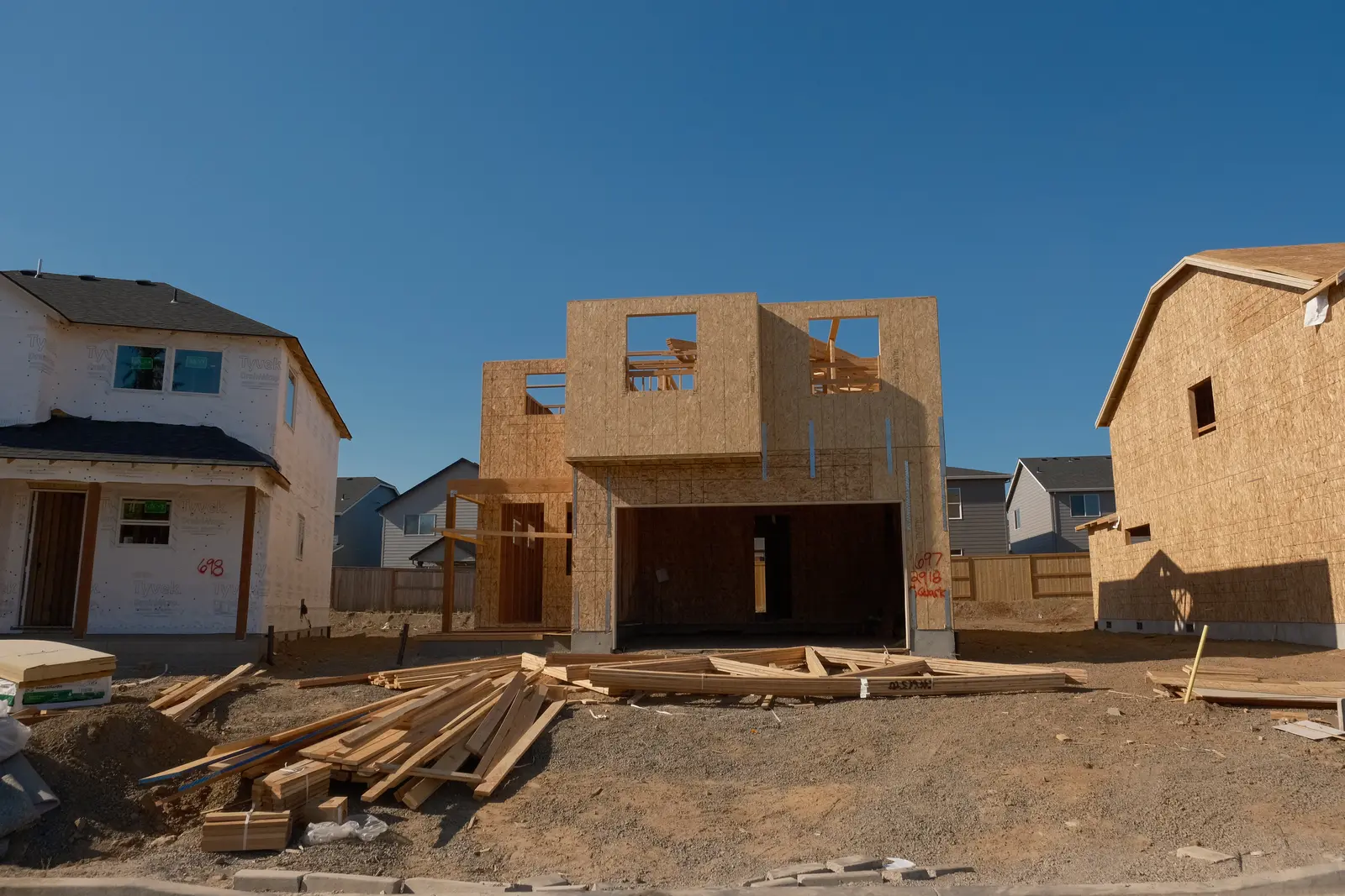 Holt Homes residential building under construction with wood framing and sheathing
