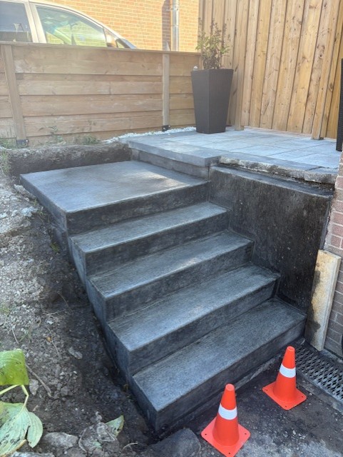 New poured concrete steps and landing at a Mississauga side entrance