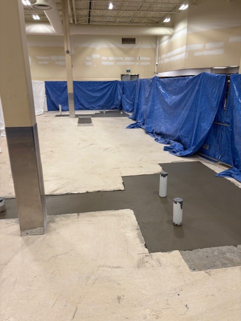 Concrete floor infill poured during a retail renovation in Oakville
