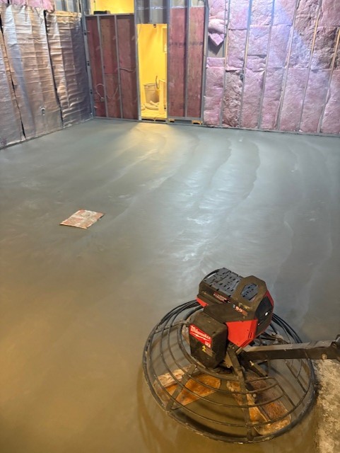 Interior concrete floor power trowelled in an Oshawa basement