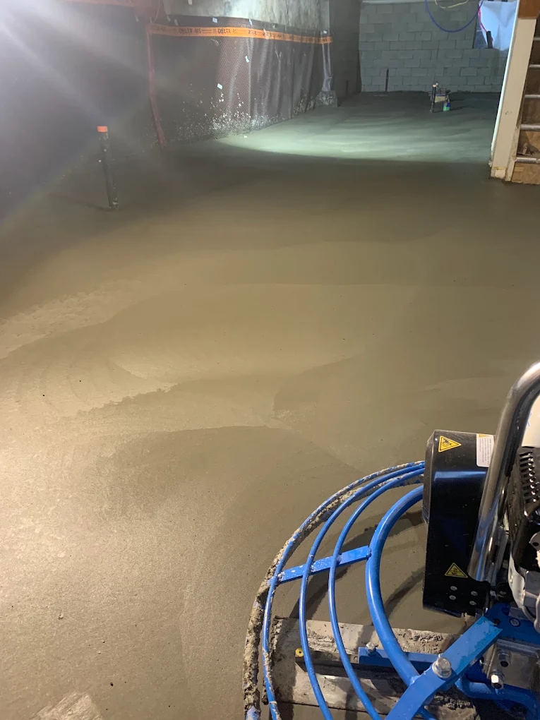 Interior concrete floor being power trowelled in Brampton