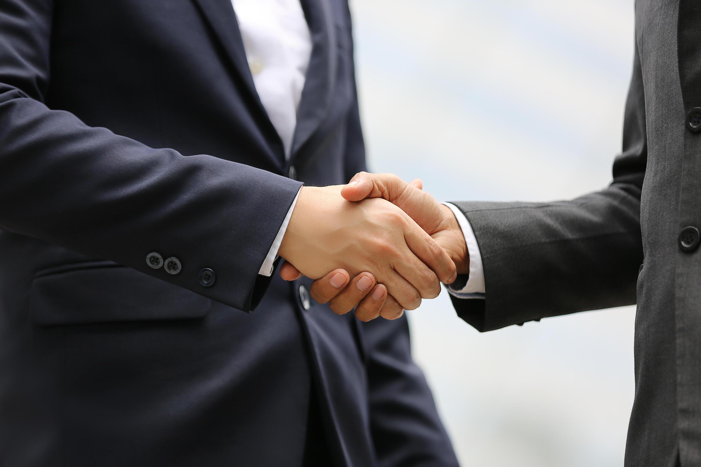Business handshake, contract signing, or California commercial property