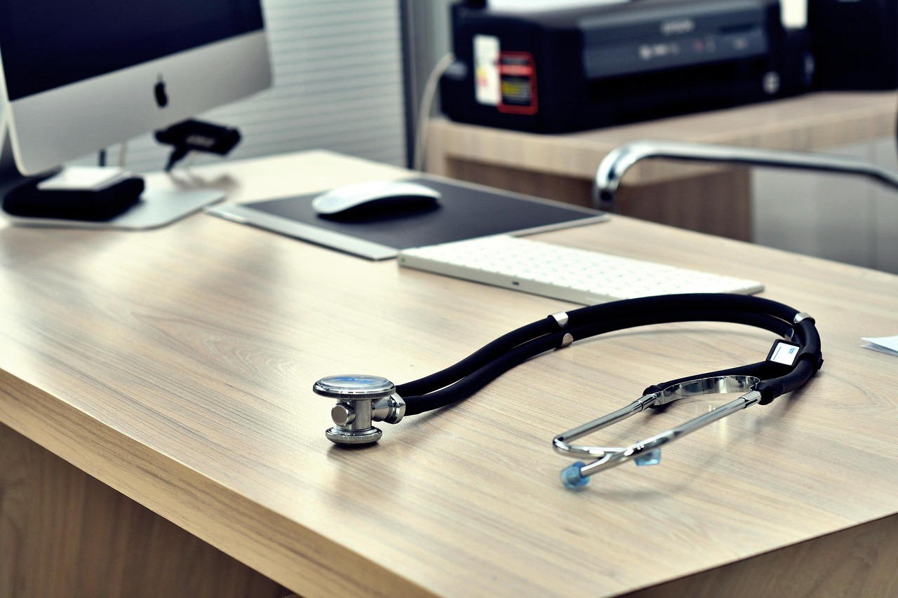 A stethoscope resting on a physician’s desk.