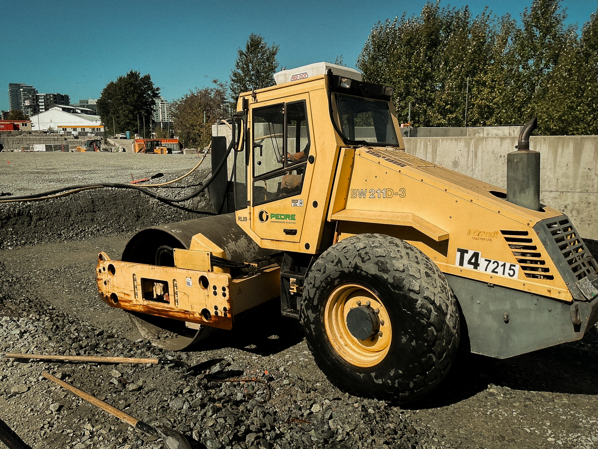Road building equipment grading subgrade in Metro Vancouver