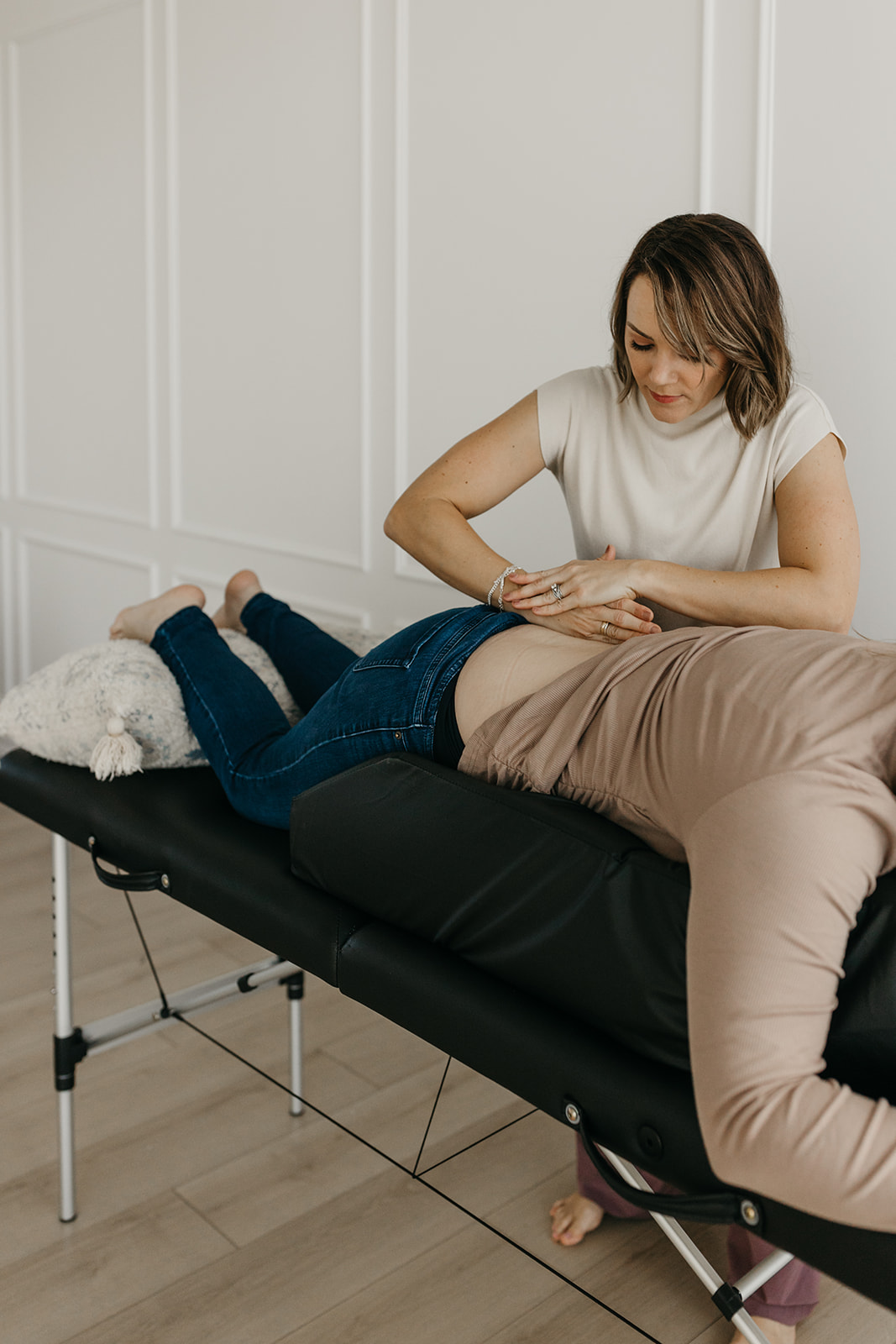 Dr. Hailey assessing a side-lying pregnant client