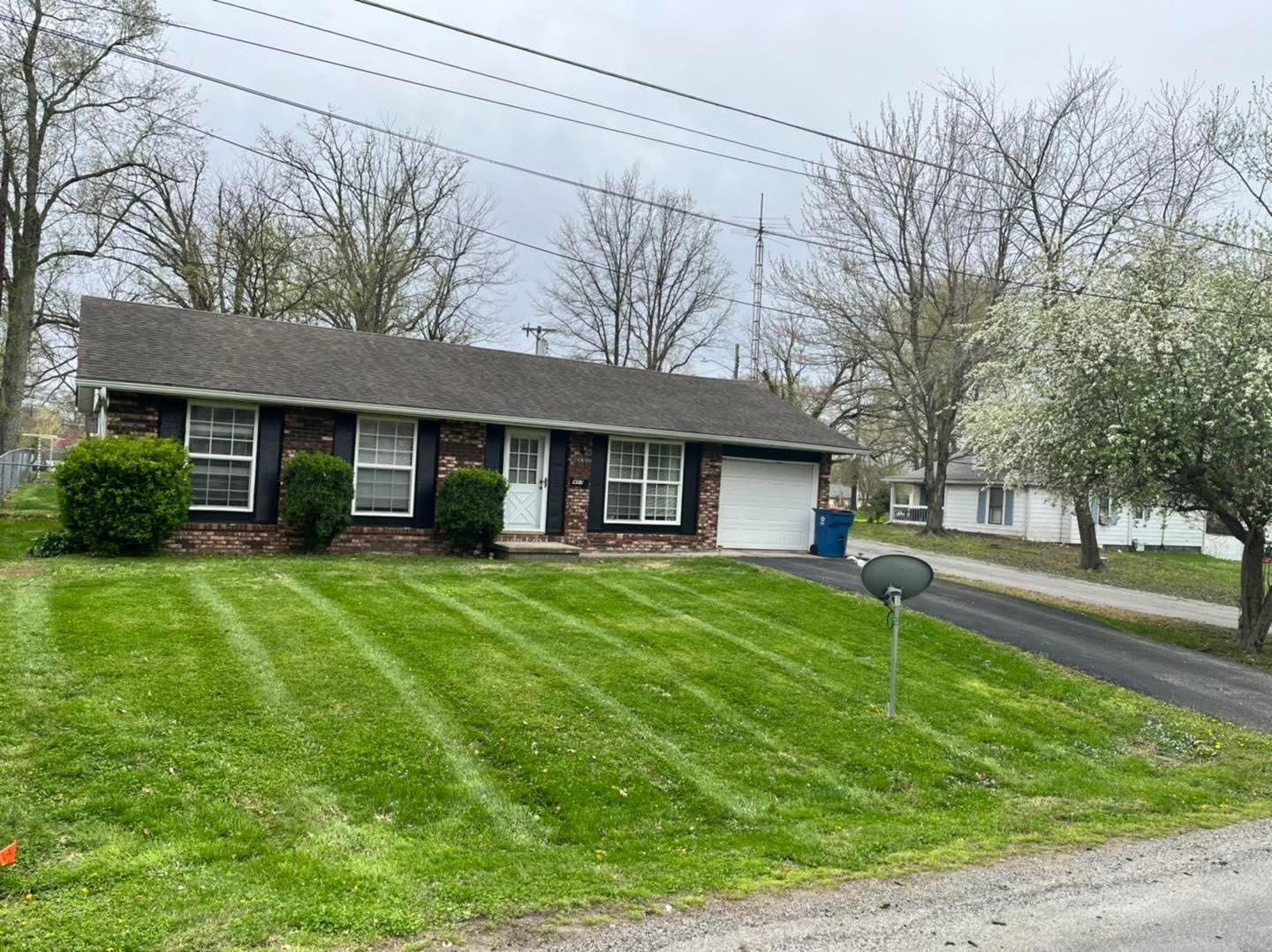 Expertly trimmed bushes and shrubs framing a Carbondale home