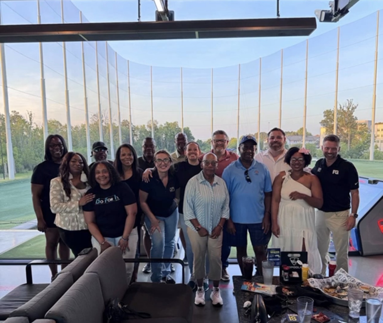 A'KERA team members together at Topgolf