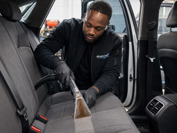 Interior fabric seat extraction cleaning during a full auto detail service