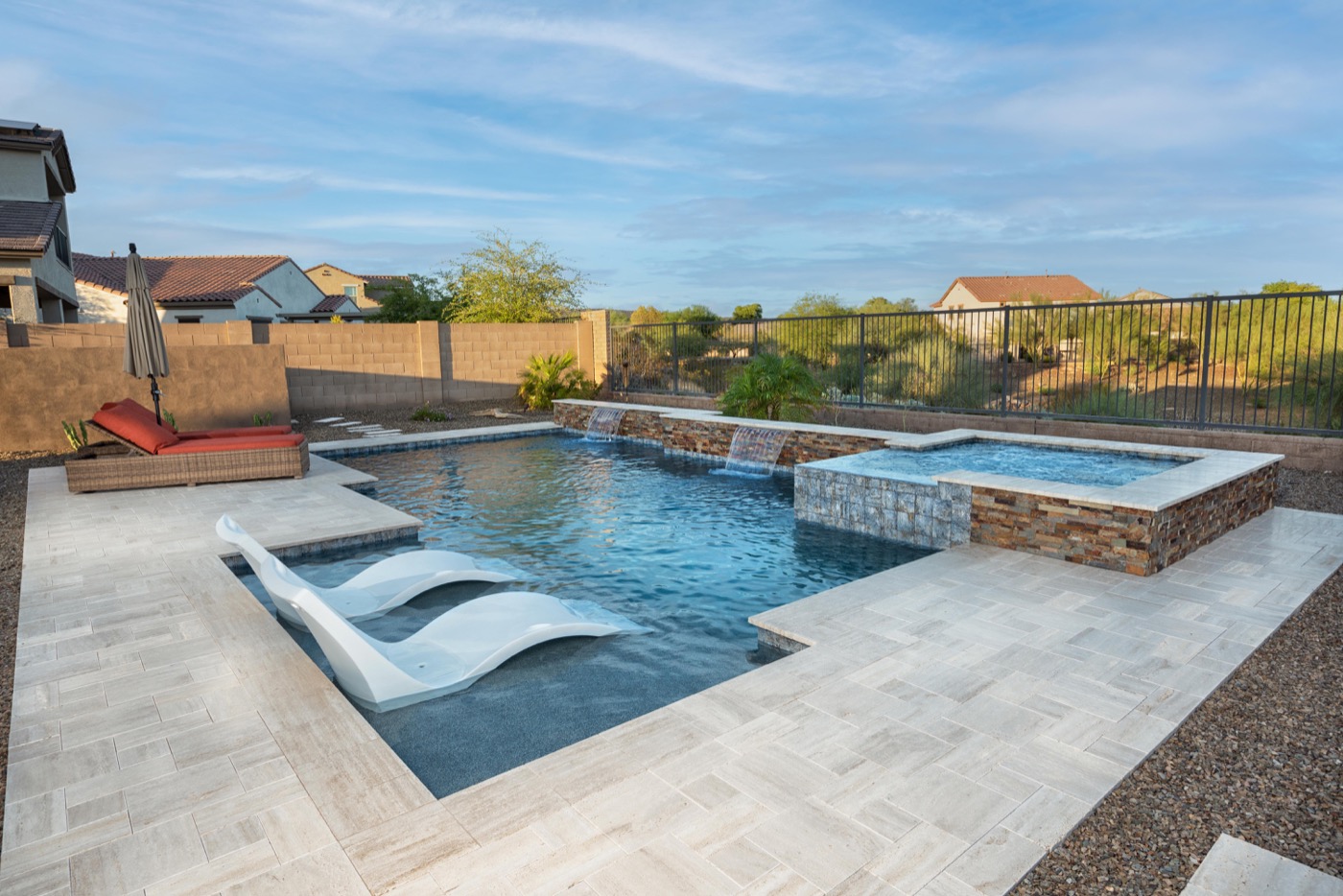Modern custom pool with raised spa and water features — Phoenix Arizona