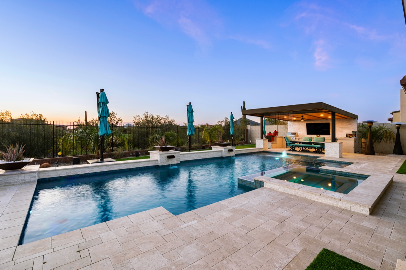 Custom pool and spa with covered patio at dusk — Thunderbird Pools & Spas, Phoenix AZ