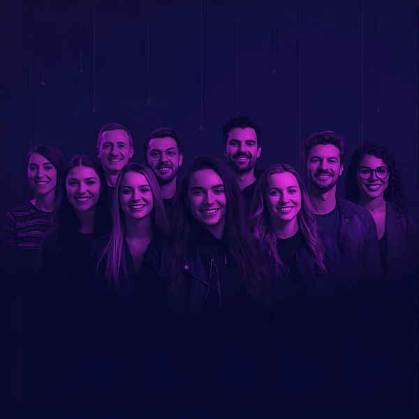 A group of ten people standing together and smiling, illuminated by purple and blue lighting against a dark gradient background