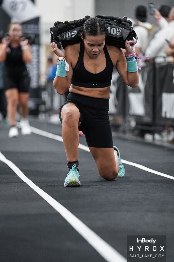 Dr. Tran doing sandbag lunges