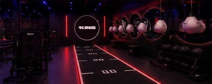 Sled track and heavy bags under the 1KING wall sign