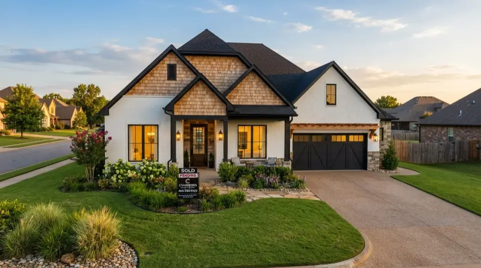 A brand new construction home in the Oklahoma City metro at golden hour with a clean modern exterior and landscaped front yard
