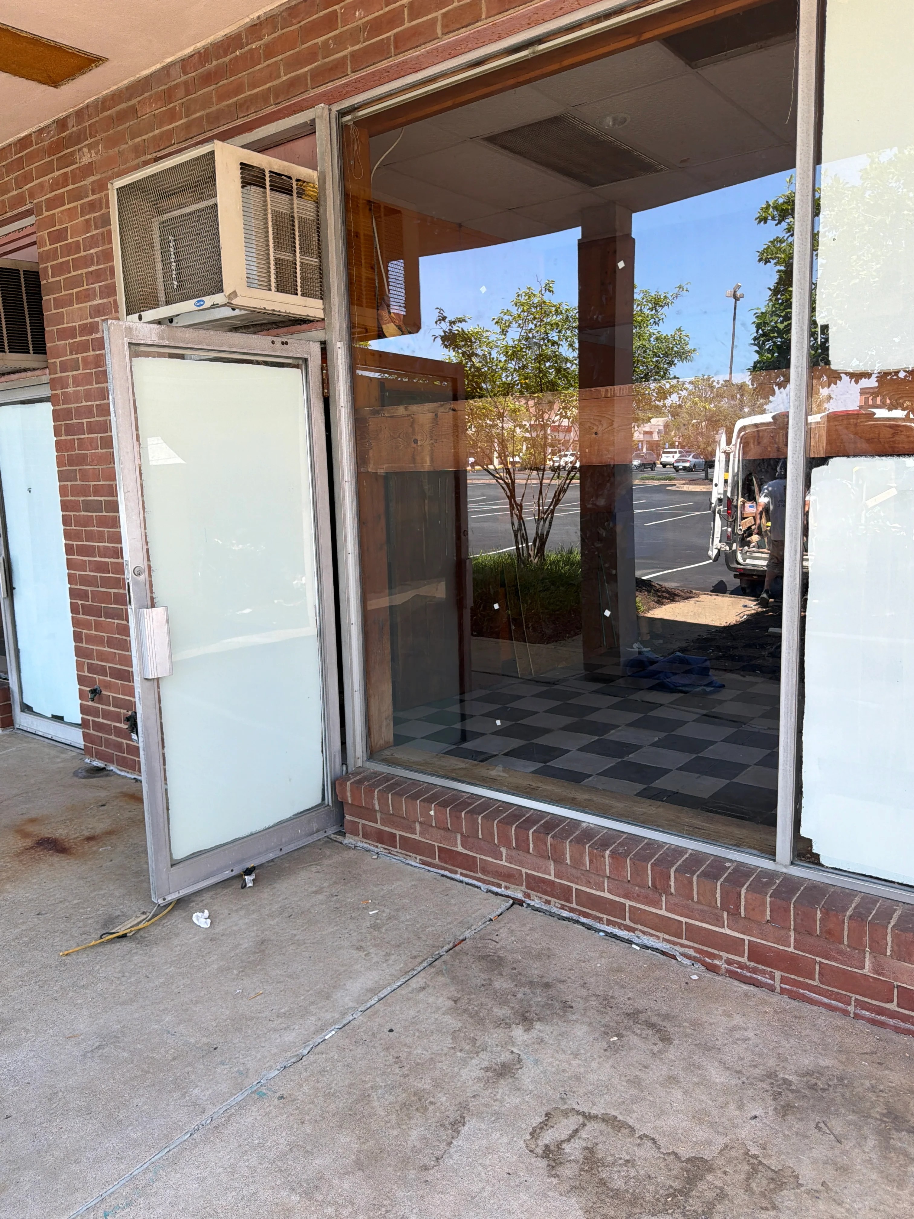 Residential frameless glass shower enclosure with chrome hardware and clean edge finishing