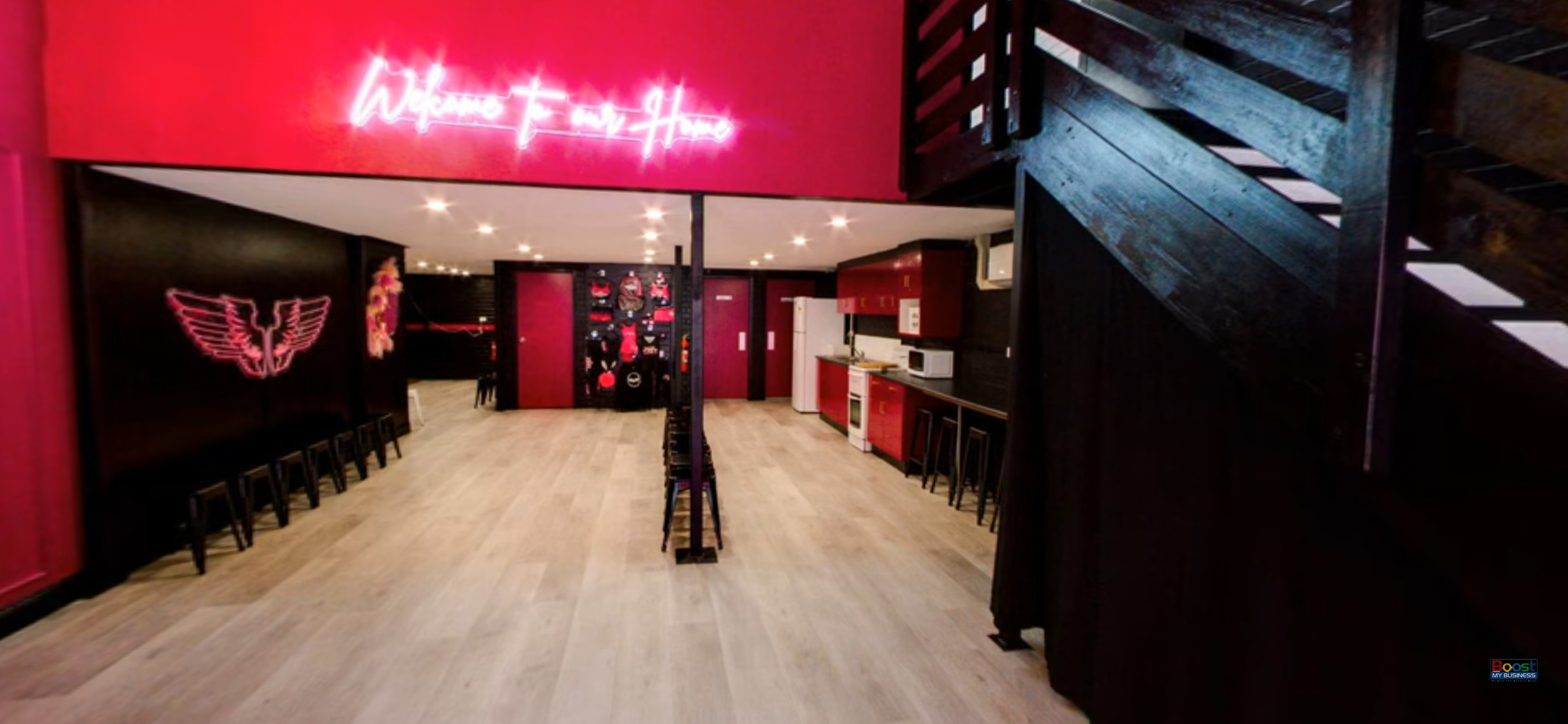 Spacious and welcoming pink and black waiting room at NRG Studios Allstars, the top dance and cheerleading studio in Wollongong for kids and families