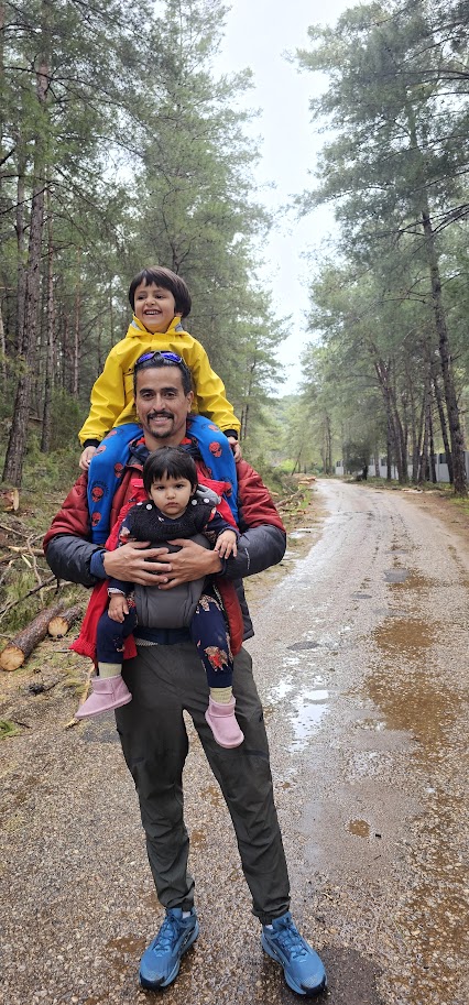 Neil hiking with his kids
