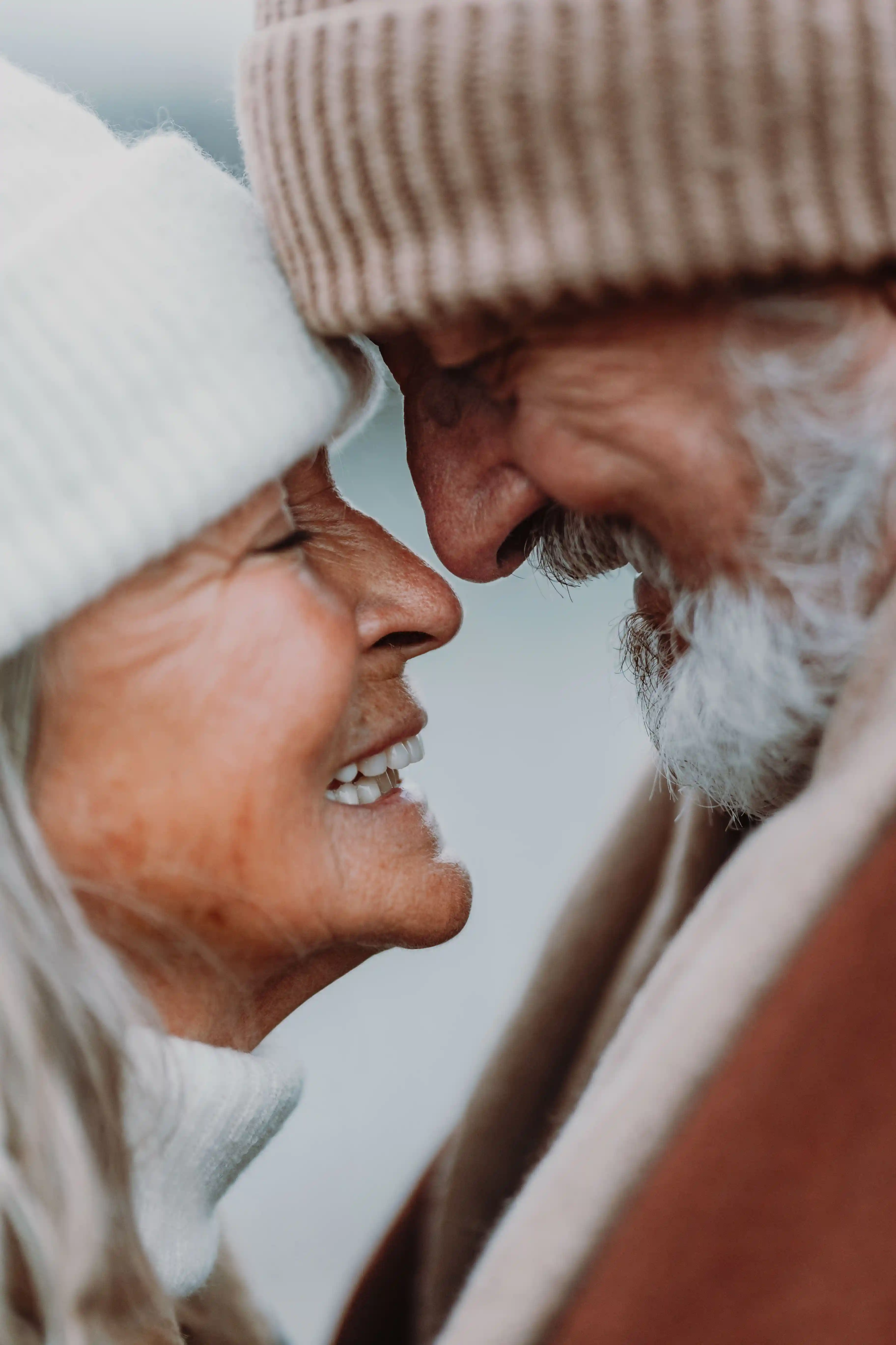 Retired couple embracing, showcasing peace of mind with local Medicare and senior benefit options in Moapa Valley.