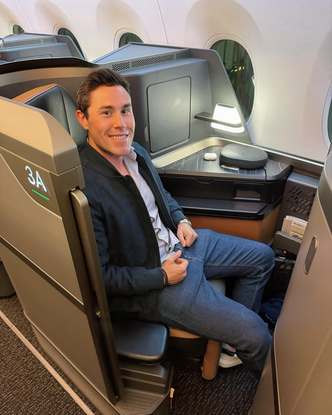 Travis in a premium cabin