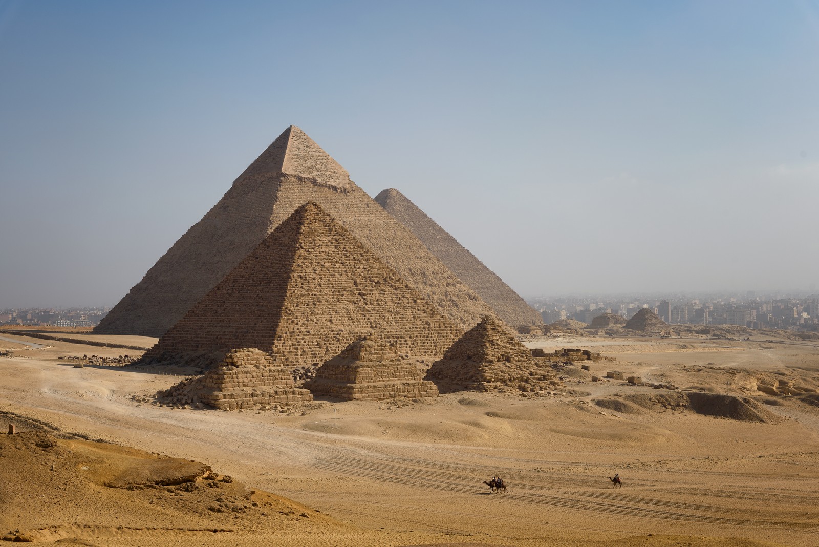 The pyramids at Giza in a desert landscape.