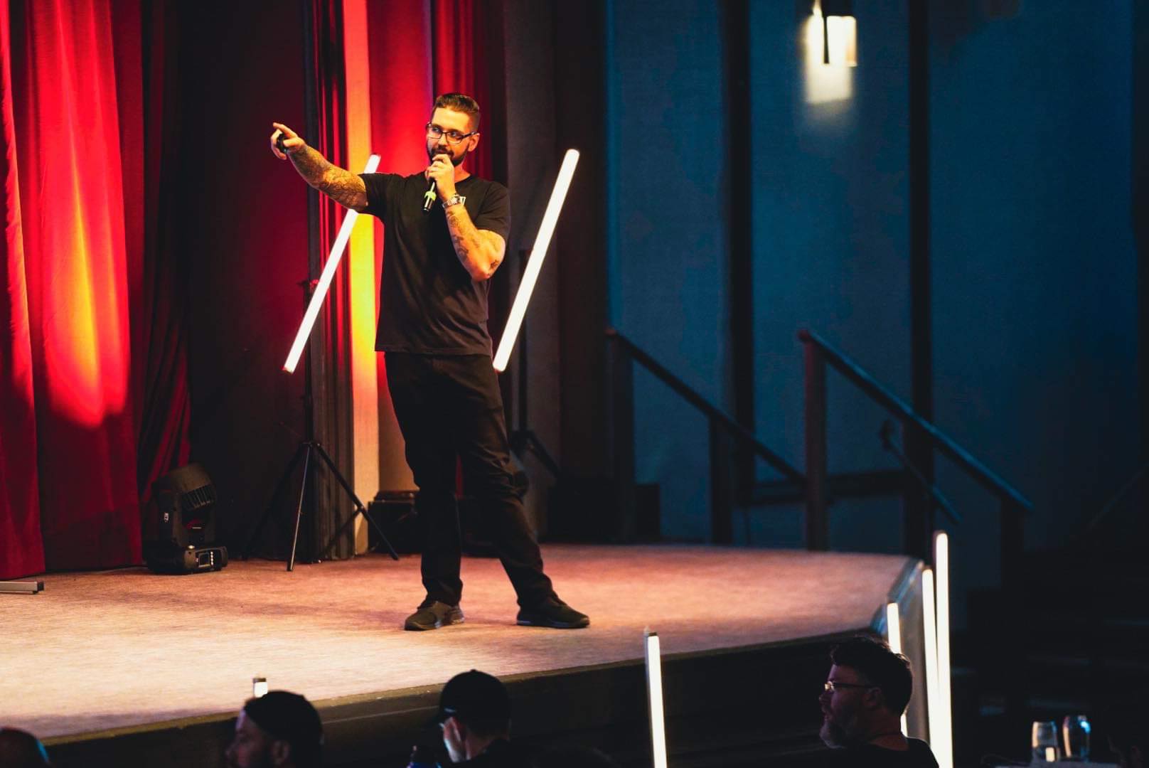 Drewbie Wilson speaking on stage