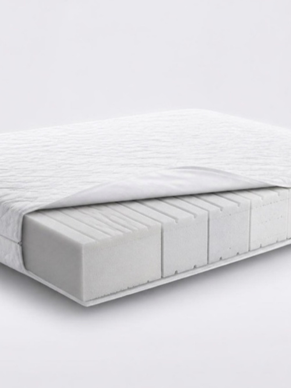 Materasso IdealCell bianco con il rivestimento aperto su fondo bianco