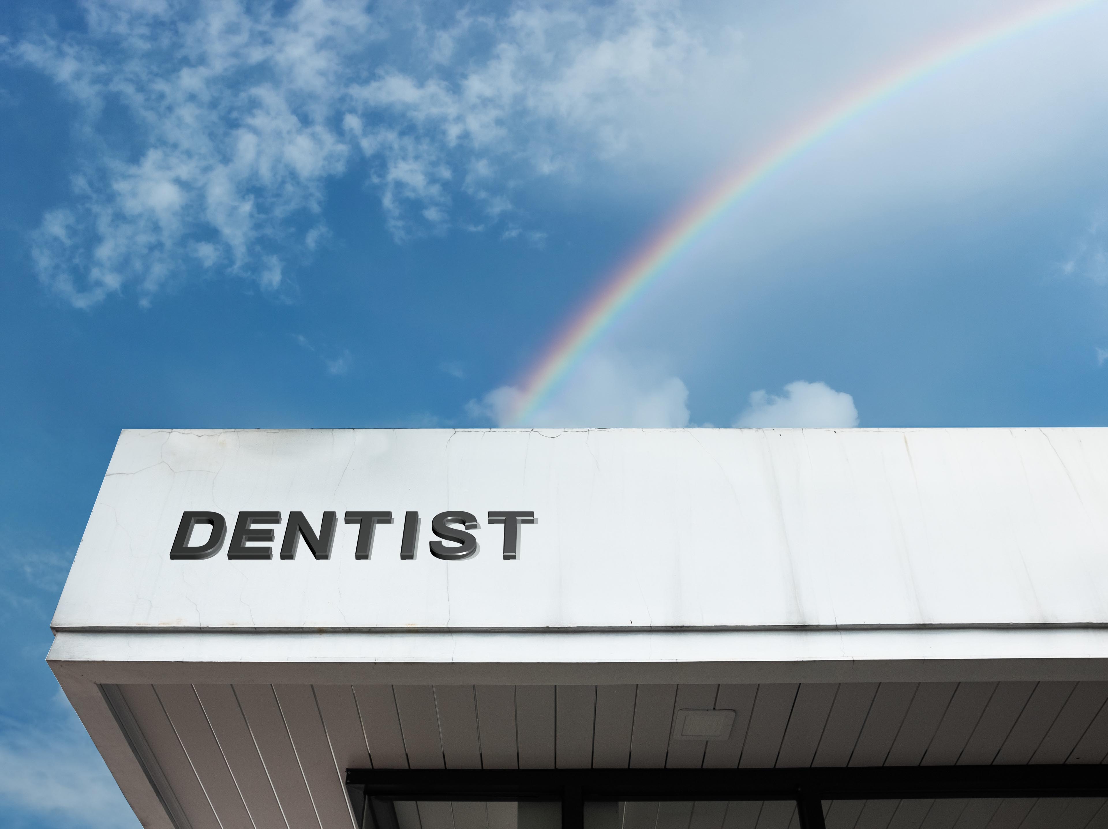 Dentist office with rainbow in sky