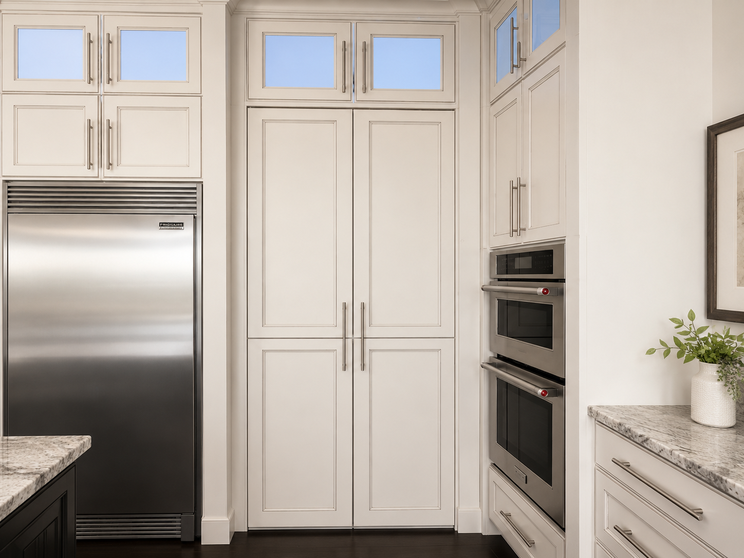 Custom pantry and laundry cabinetry fitted to the room