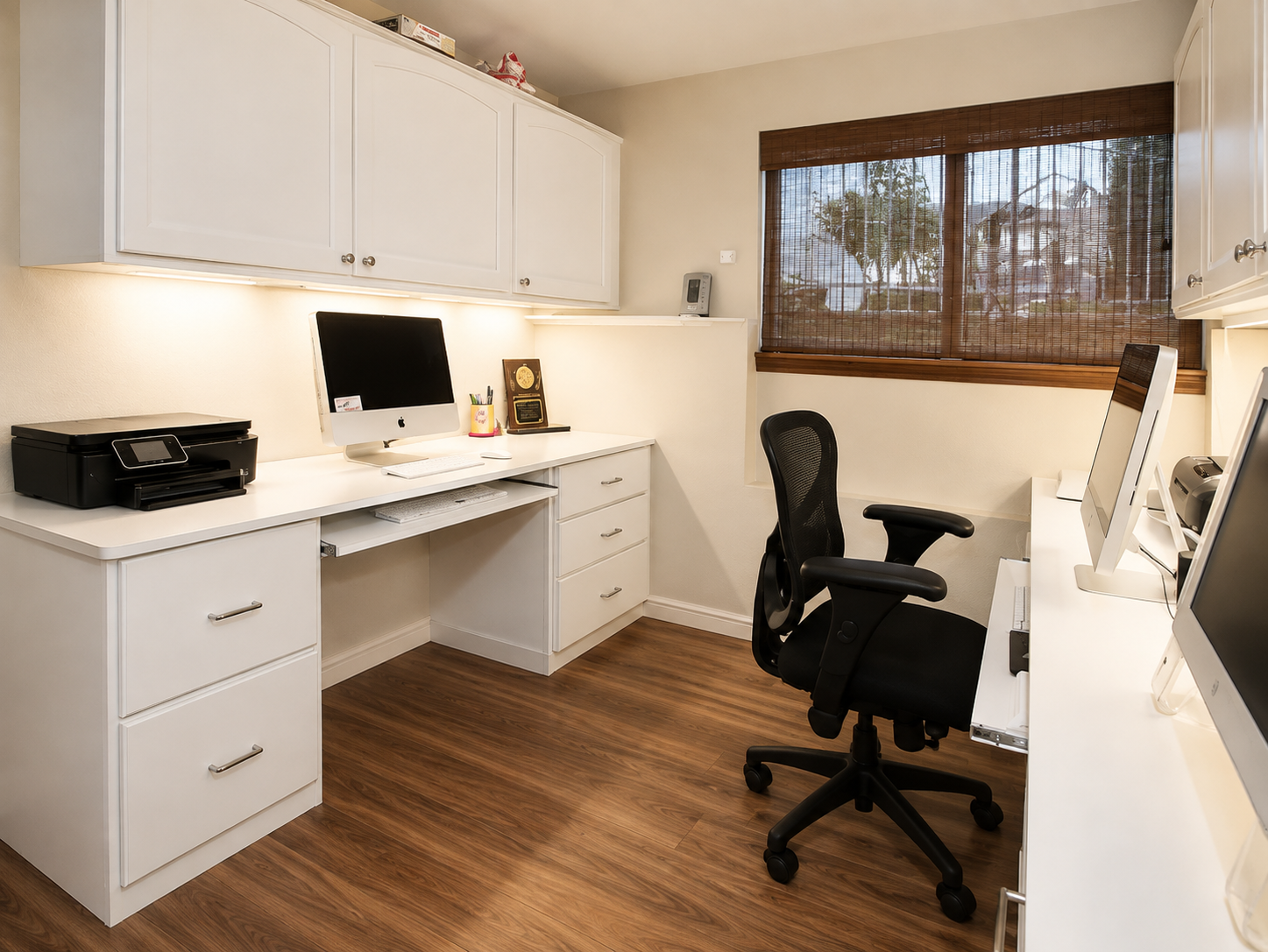 Custom office cabinetry and integrated workspace storage