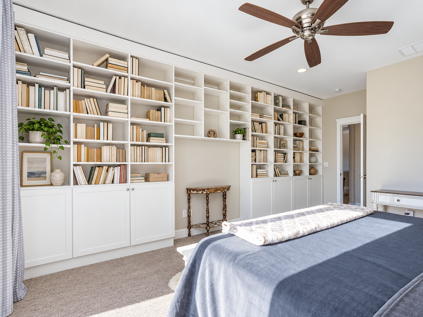 Custom library shelving by All City Closet Company