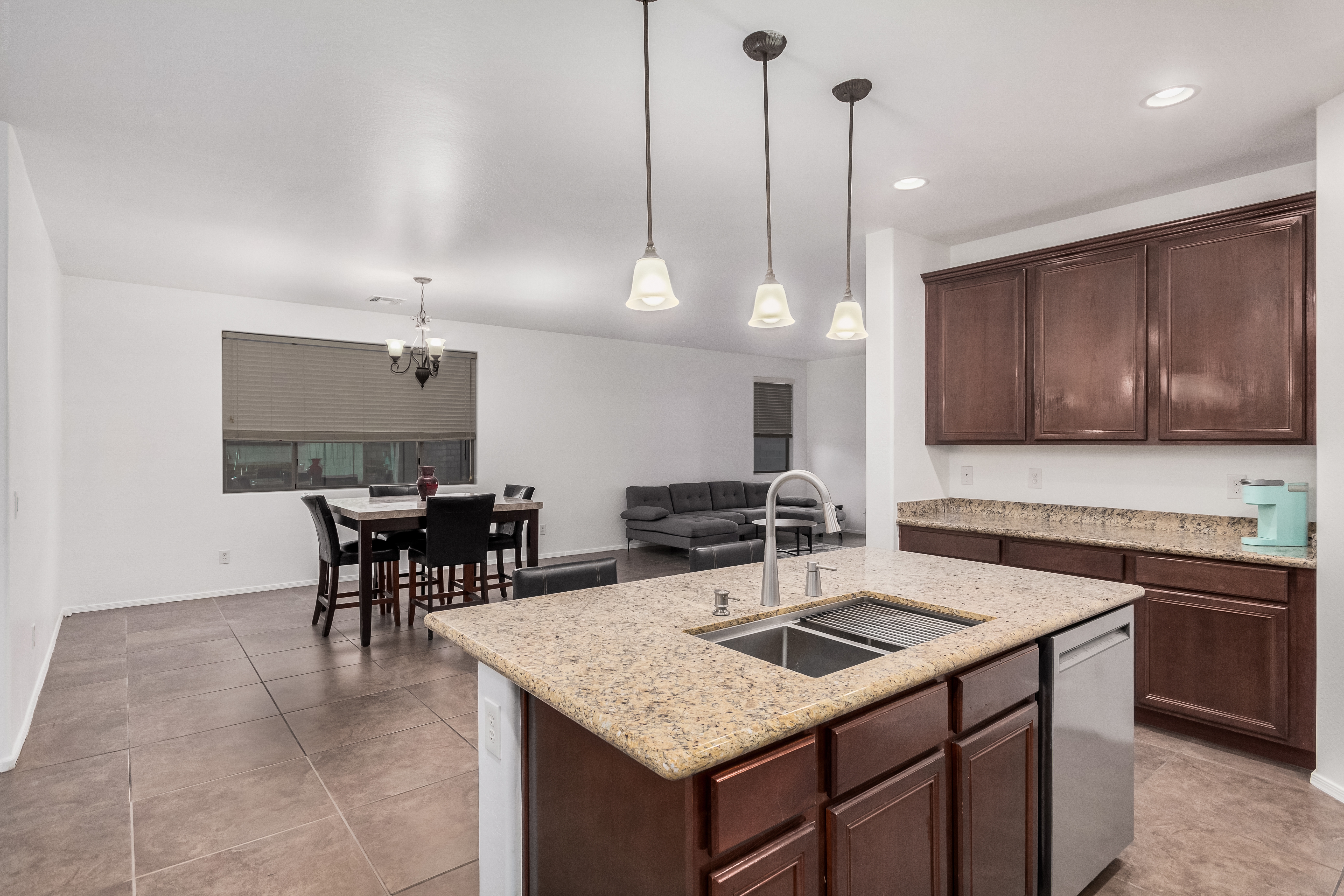 Updated kitchen with 42-inch cabinets and granite countertops in Goodyear AZ FSBO home