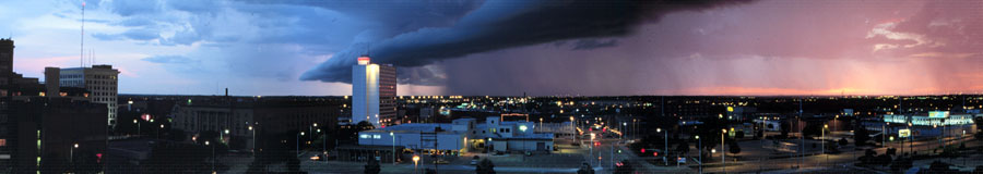 The original 2006 Genius Types header photo: a city skyline under a storm front at dusk