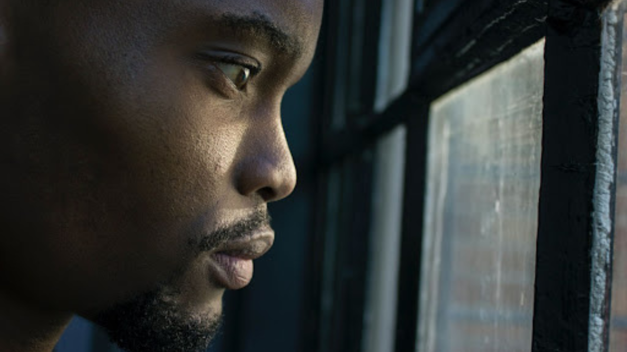 Man looking out window Man looking out window